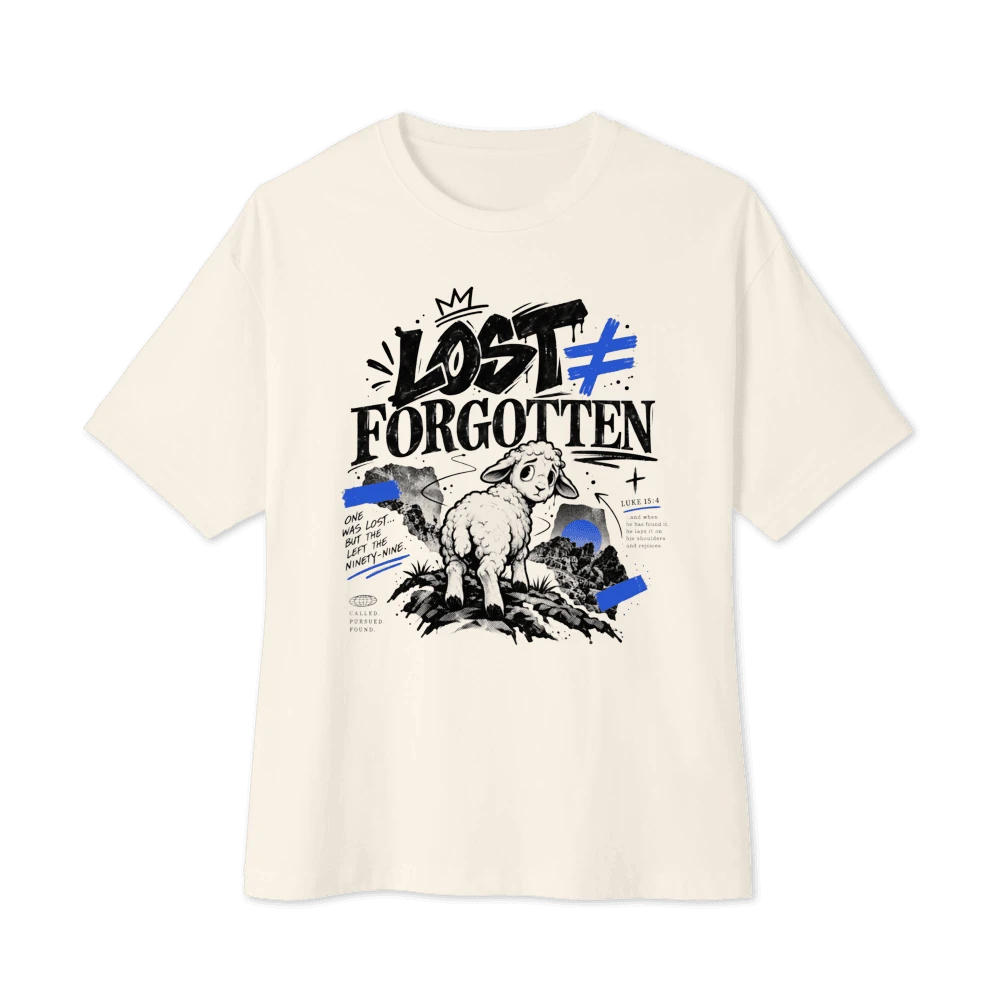 Bone boxy tee with Lost ≠ Forgotten sheep artwork and blue accents
